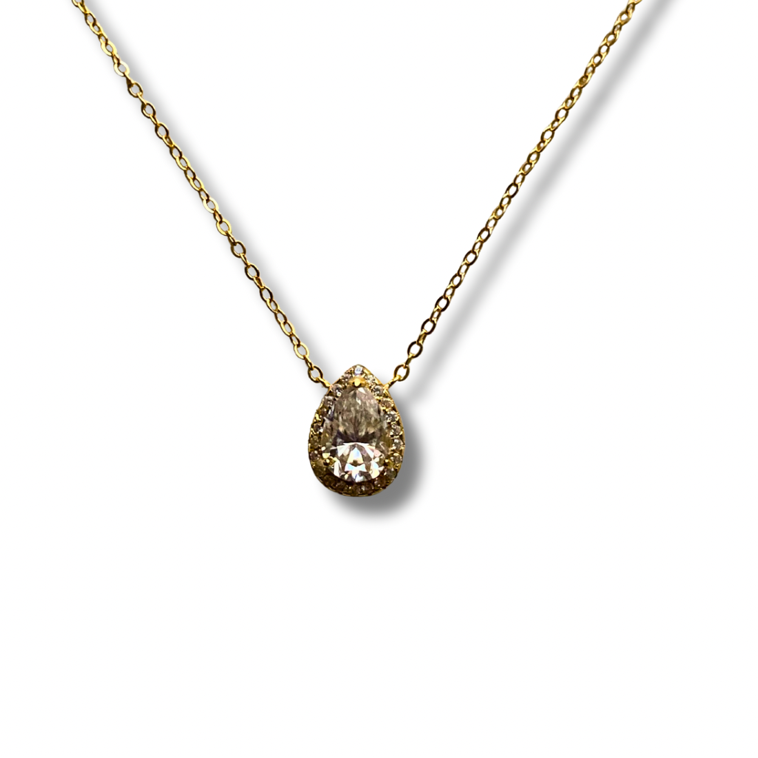 Gold necklace with a teardrop pendant on a white background