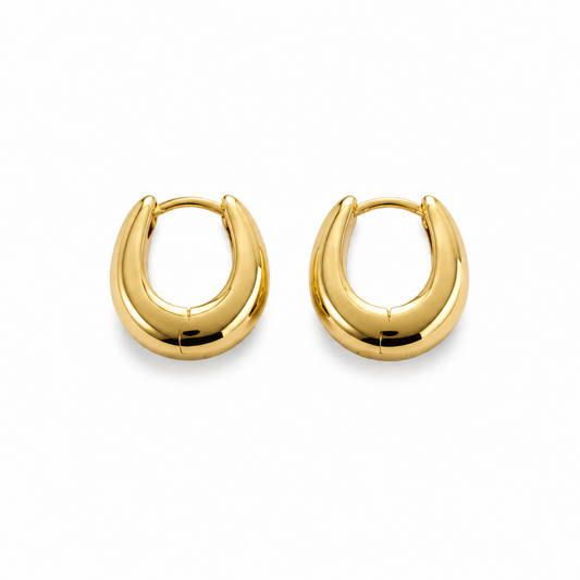 Pair of gold hoop earrings on a white background