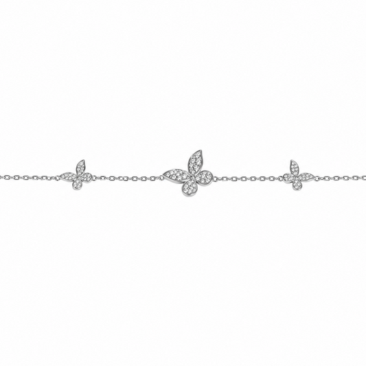 Silver anklet with butterfly charms on a white background