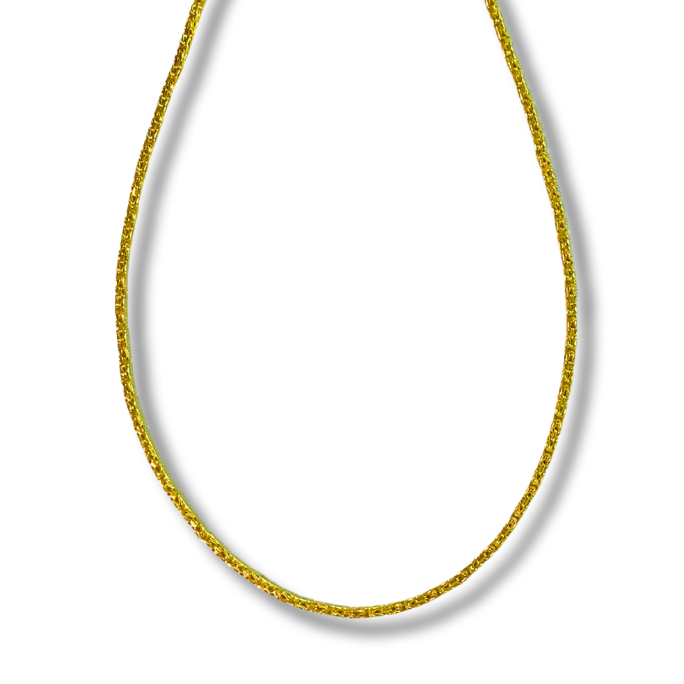 Gold chain necklace on a white background