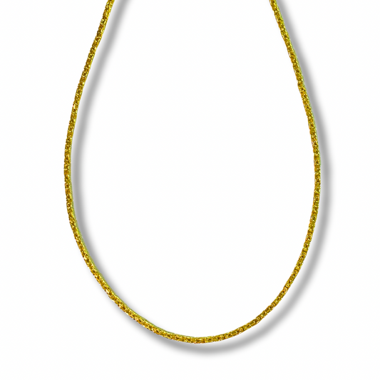 Gold chain necklace on a white background