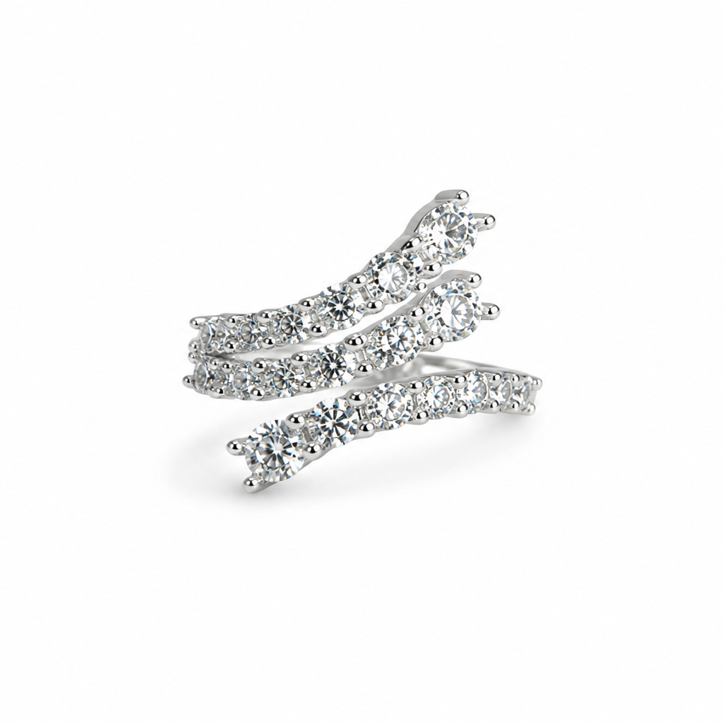 Silver ring with multiple curved prongs on a white background