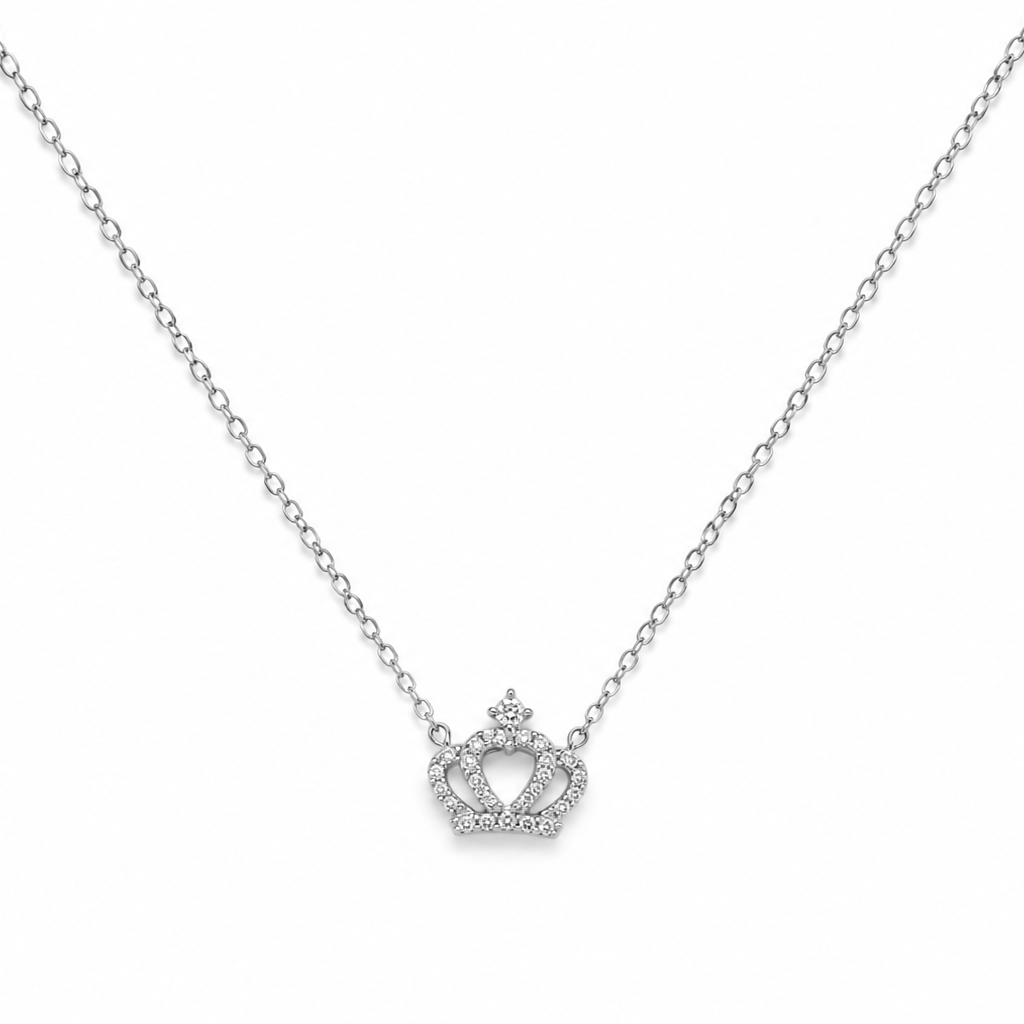Silver necklace with a crown-shaped pendant on a white background