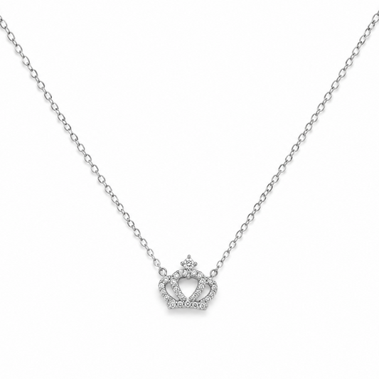 Silver necklace with a crown-shaped pendant on a white background