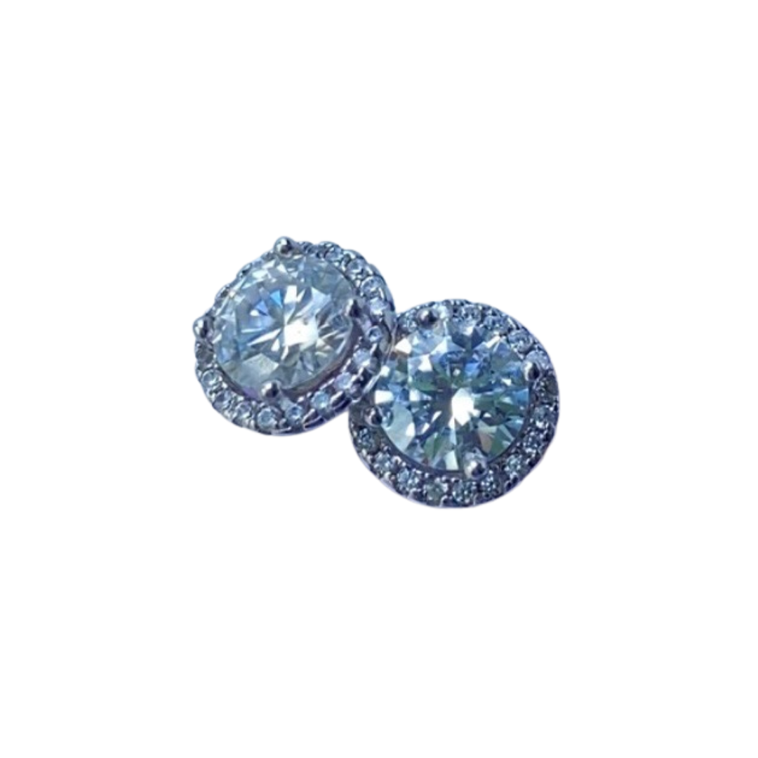 Pair of clear moissanite earrings on a white background