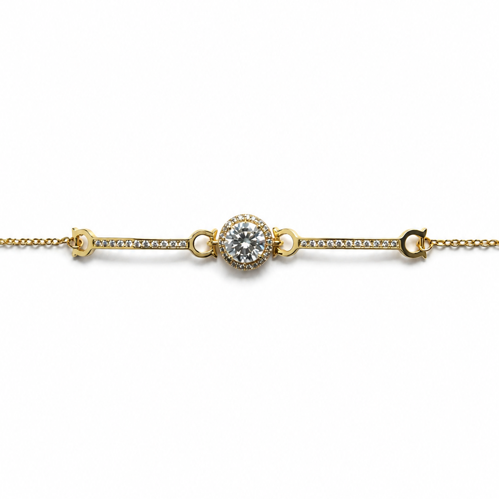 Gold bracelet with a central diamond on a white background