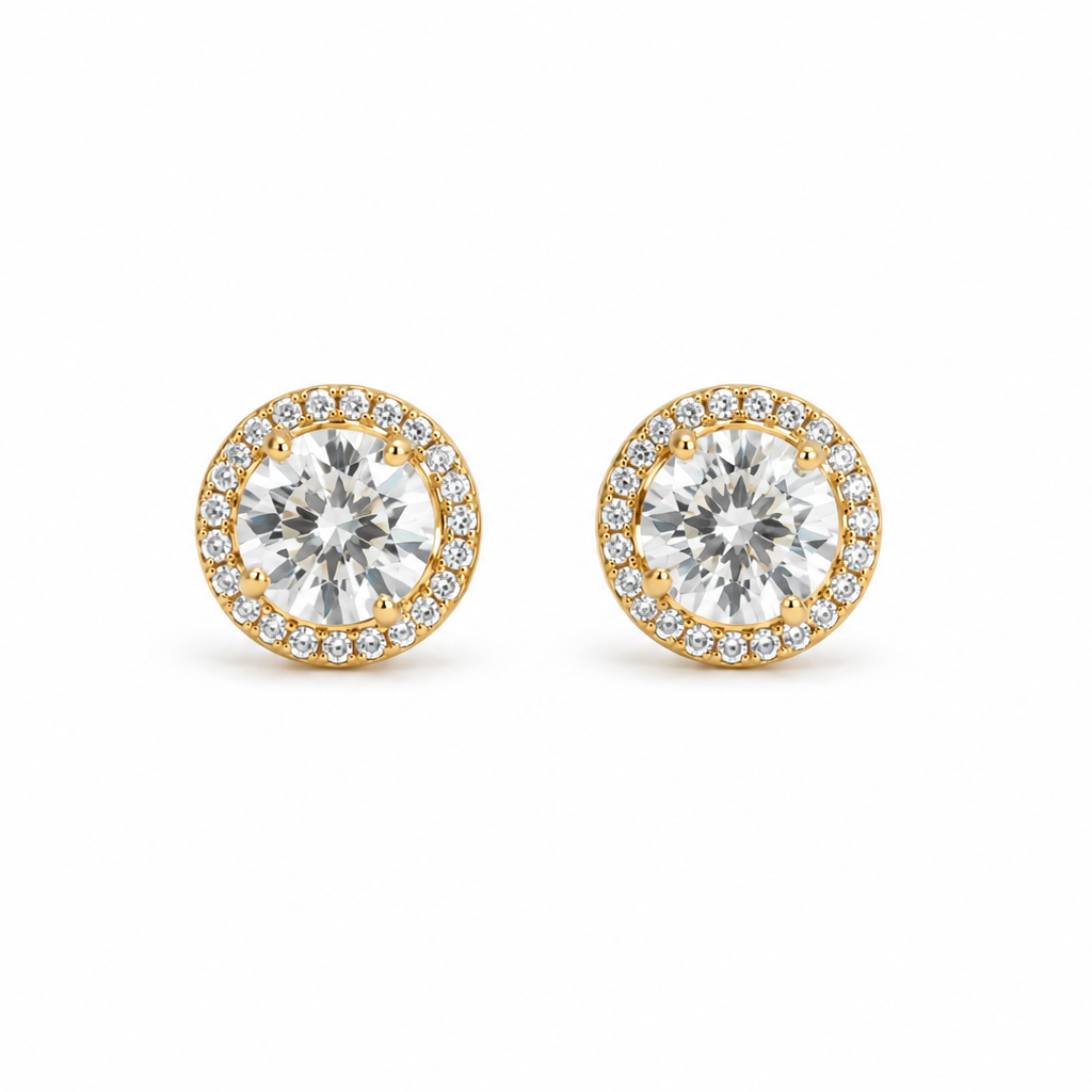 Gold earrings on a white background