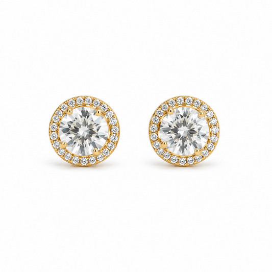 Gold earrings on a white background