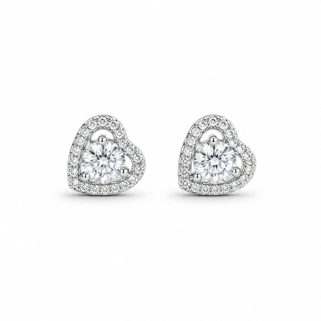 Heart-shaped diamond earrings on a white background